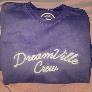 Dreamville: “Dreamville Crew” crewneck.